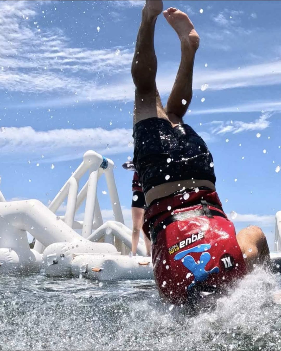Aqua Warrior participant wearing a supplied lifejacket on the course